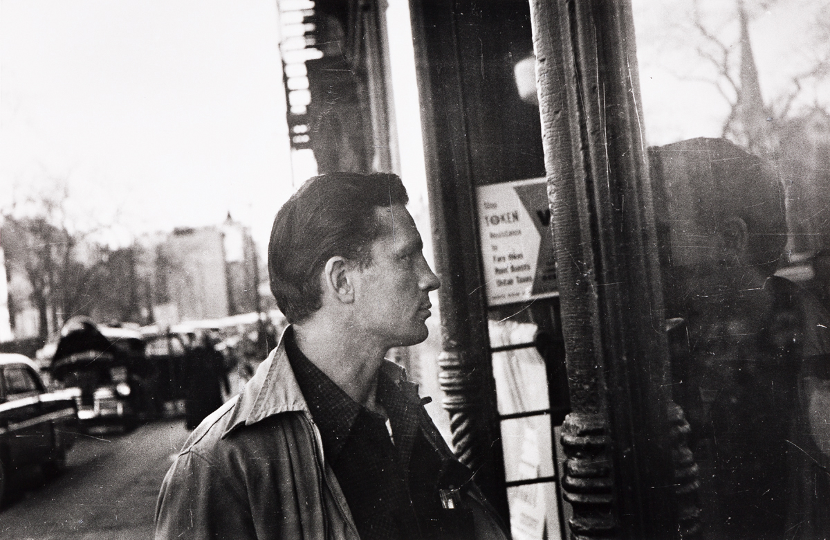 ALLEN GINSBERG (1926-1997) Jack Kerouac looking in barroom doorway.